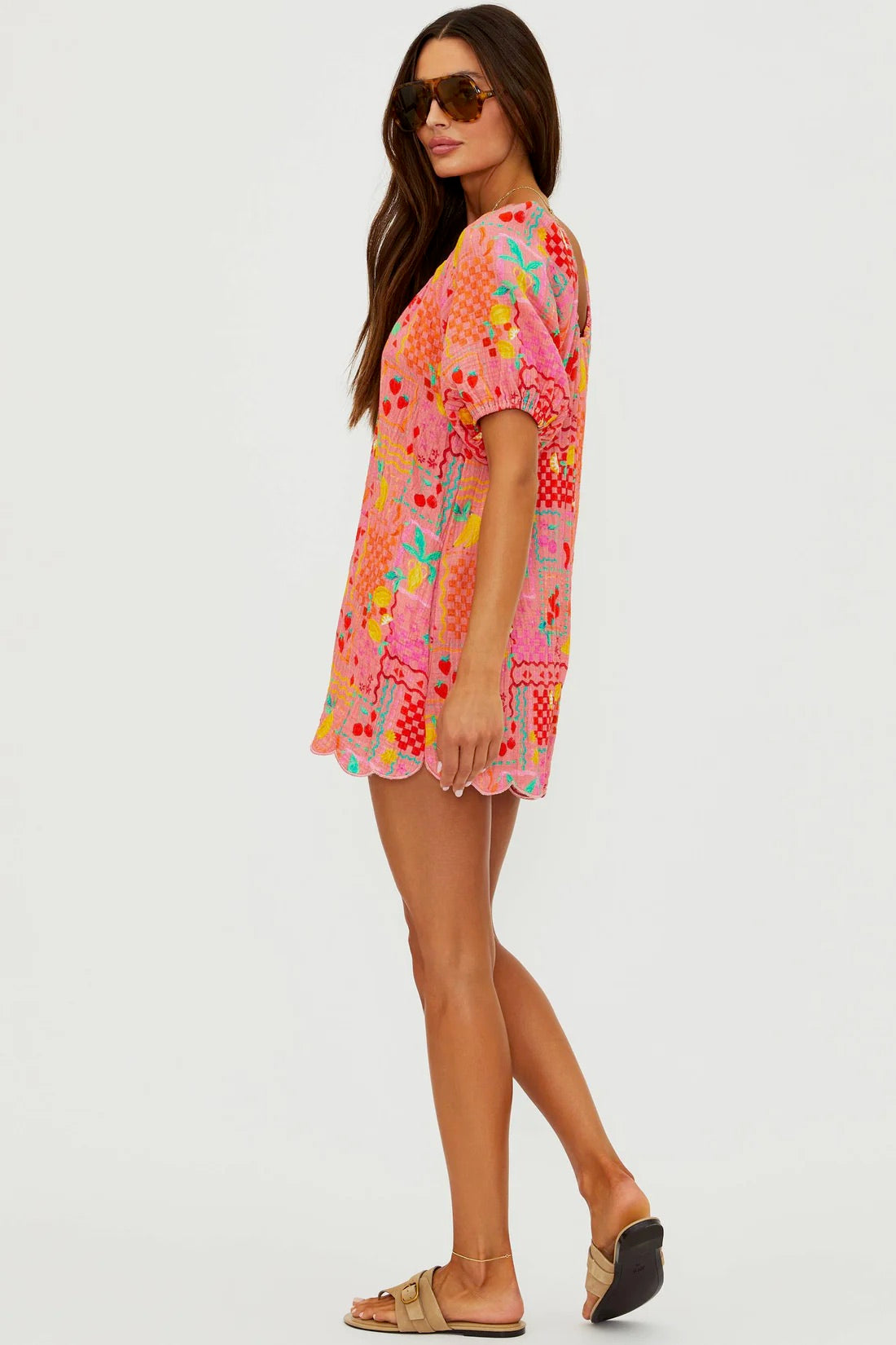 Beach Riot Ellery Romper in Passion Fruit with vibrant tropical print, sleeveless design, and tie waist for a stylish summer look.