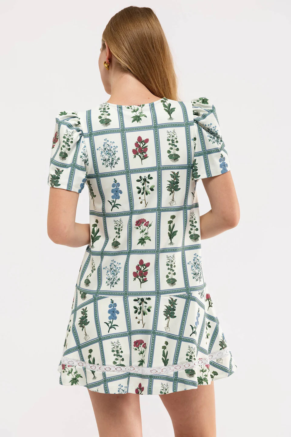 Smith & Quinn The James Dress in Gardeners Window with floral pattern and flowing fabric, displayed on a mannequin.