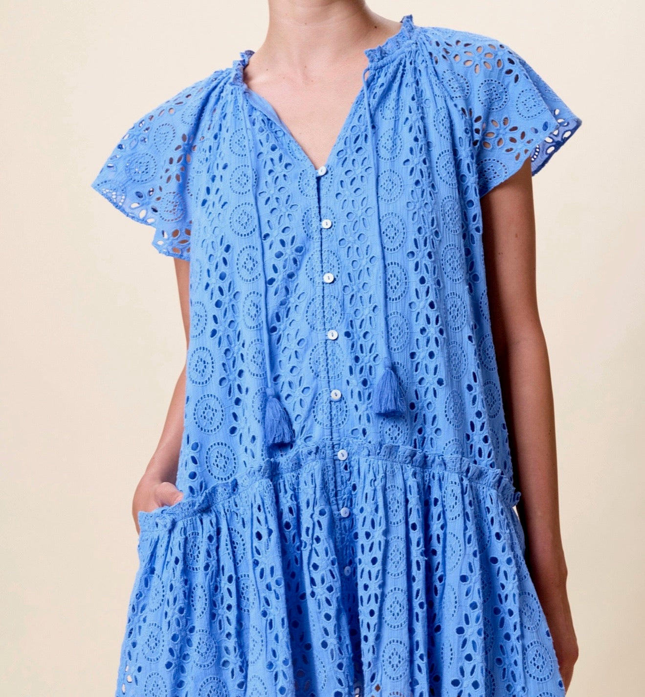 CLEOBELLA Lydia Mini Dress in Blue Bonnet color, featuring a stylish, fitted silhouette with short sleeves and a V-neck design.