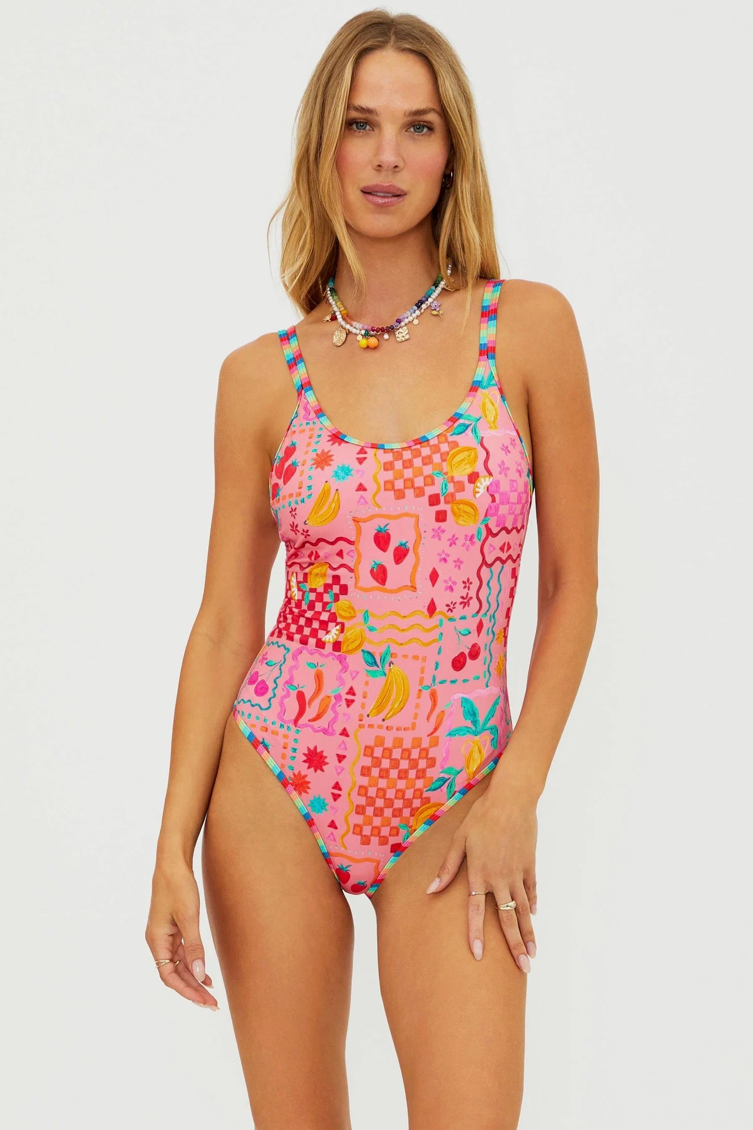 Beach Riot Naomi one-piece swimsuit in Passion Fruit with vibrant floral pattern and plunging neckline.