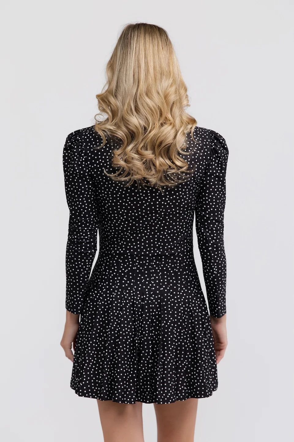 Smith & Quinn Edith Dress in black with dainty dot pattern, showcasing a stylish, feminine dress design with a fitted silhouette.