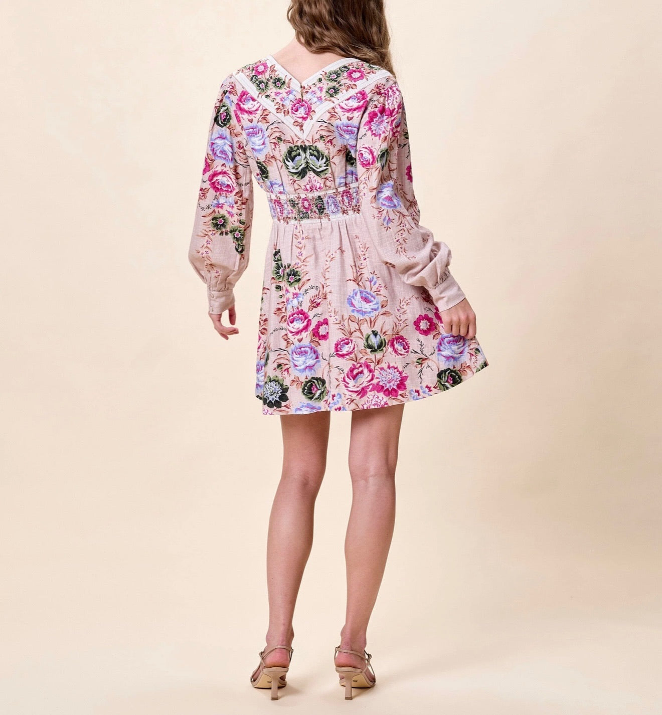 CLEOBELLA Trudy Mini Dress in Silva featuring a stylish, fitted design with short sleeves and a vibrant floral pattern.
