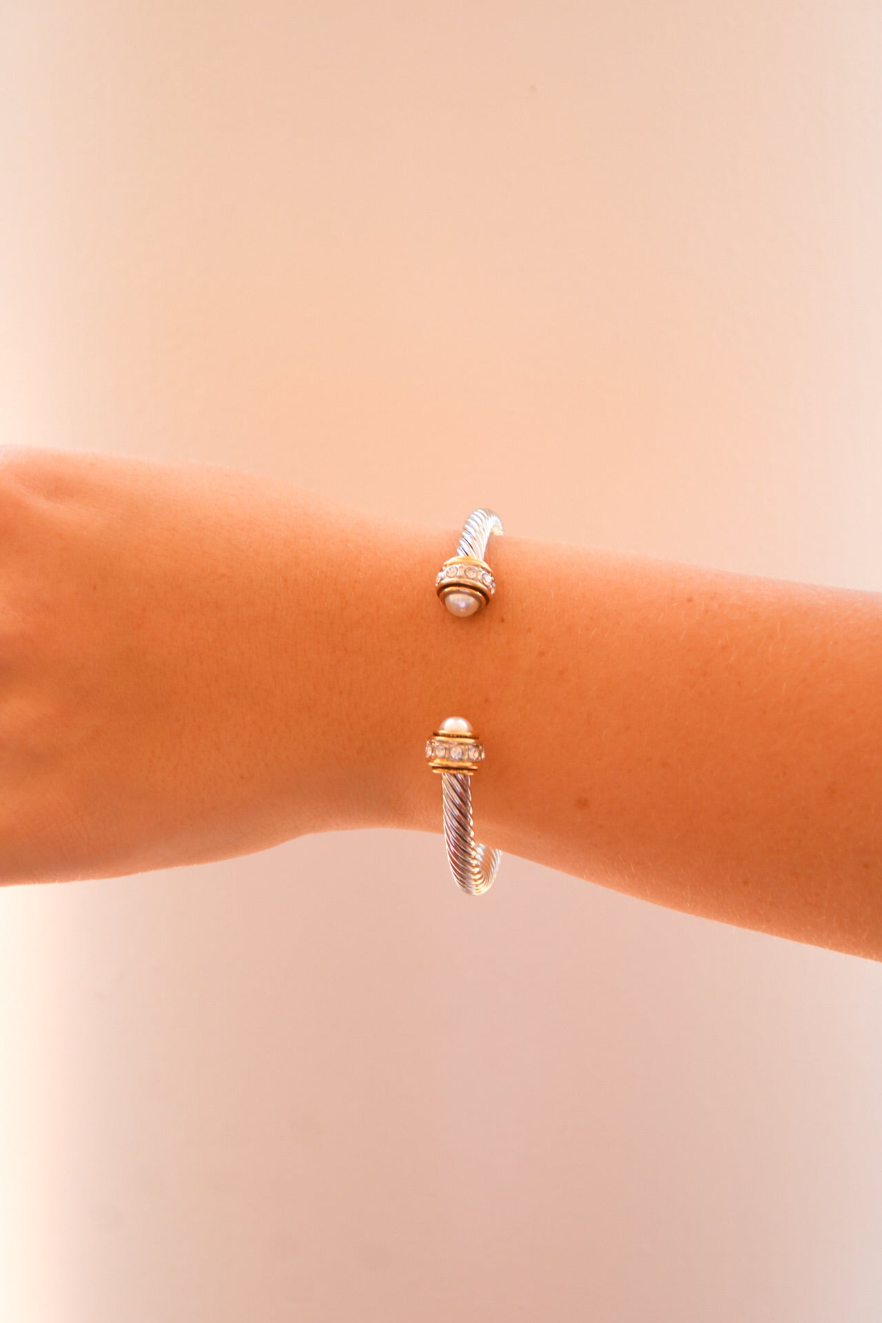 Golden Stella Pearl Cable Ribbed Cuff bracelet featuring a textured, ribbed design with pearl accents, stylish jewelry accessory.