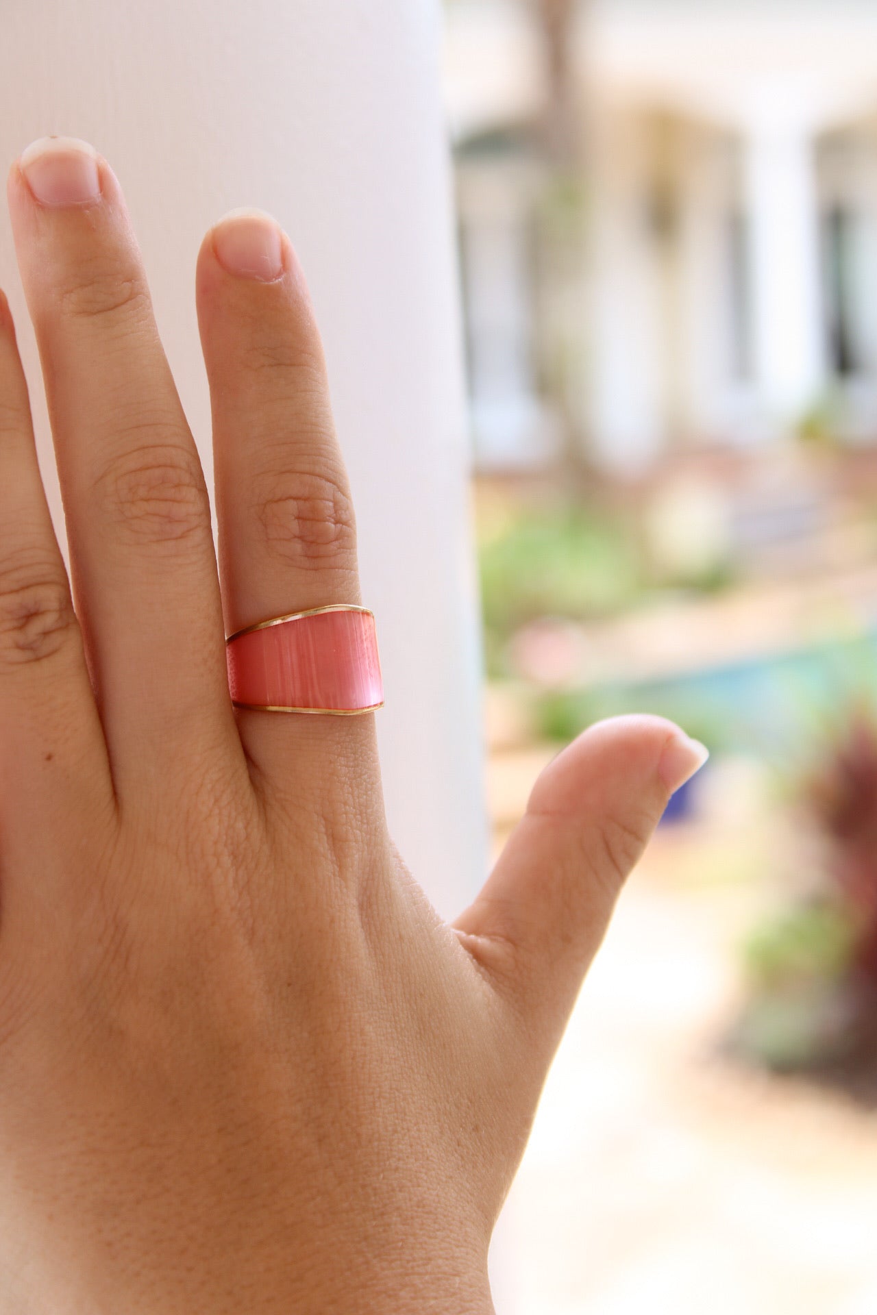 Golden Stella clear neon ring with pink glow, showcasing its vibrant, translucent design and modern style.