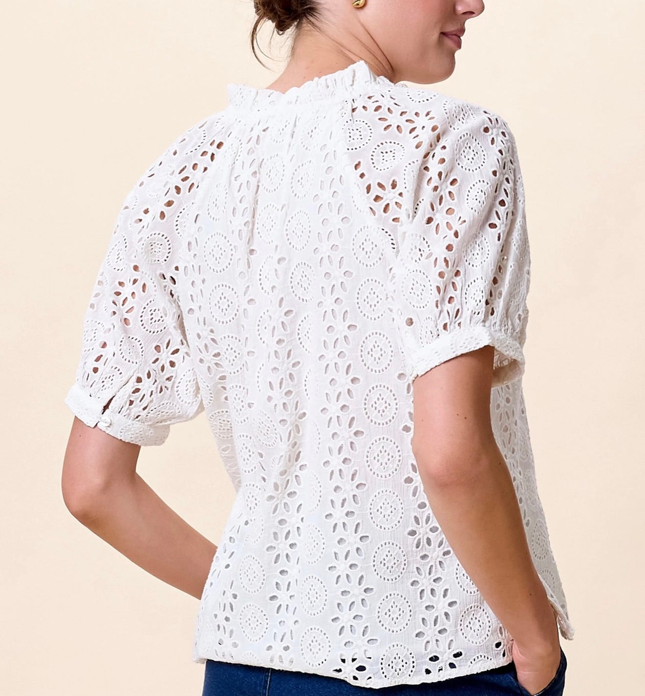 CLEOBELLA Kate Ivory Blouse featuring a lightweight fabric and elegant design, displayed on a hanger.