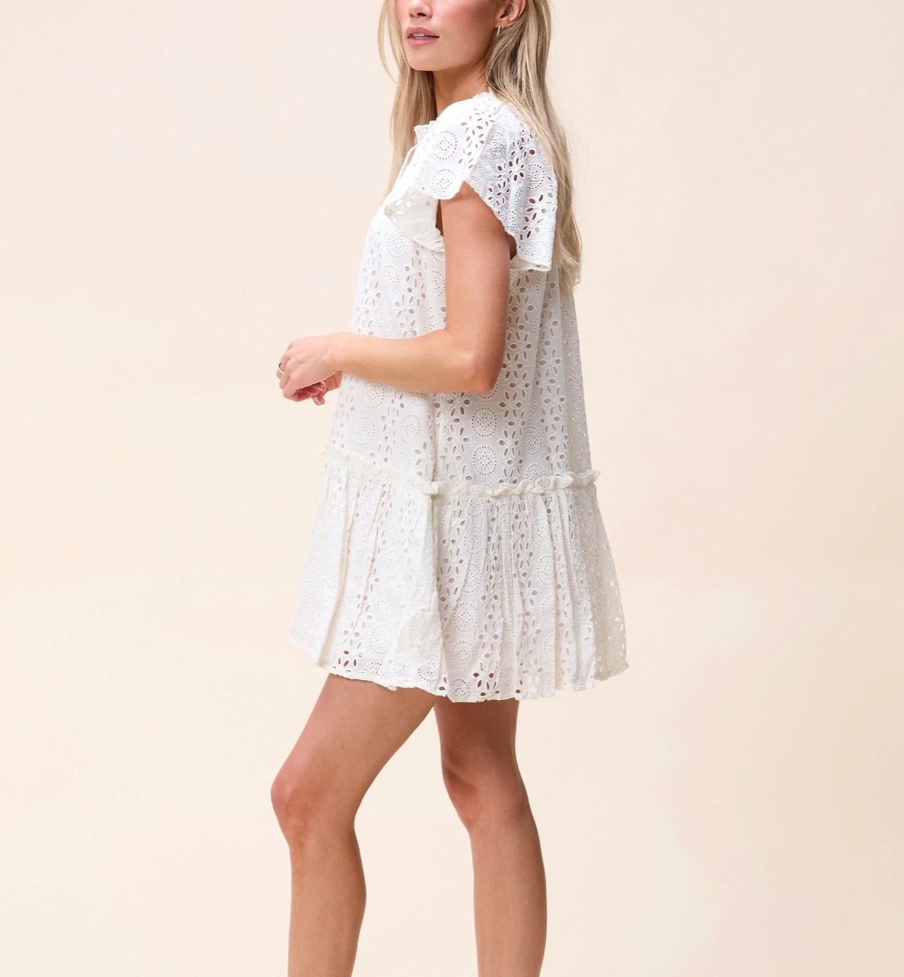 CLEOBELLA Lydia Mini Dress in ivory, stylish sleeveless dress with a fitted silhouette and delicate fabric details.