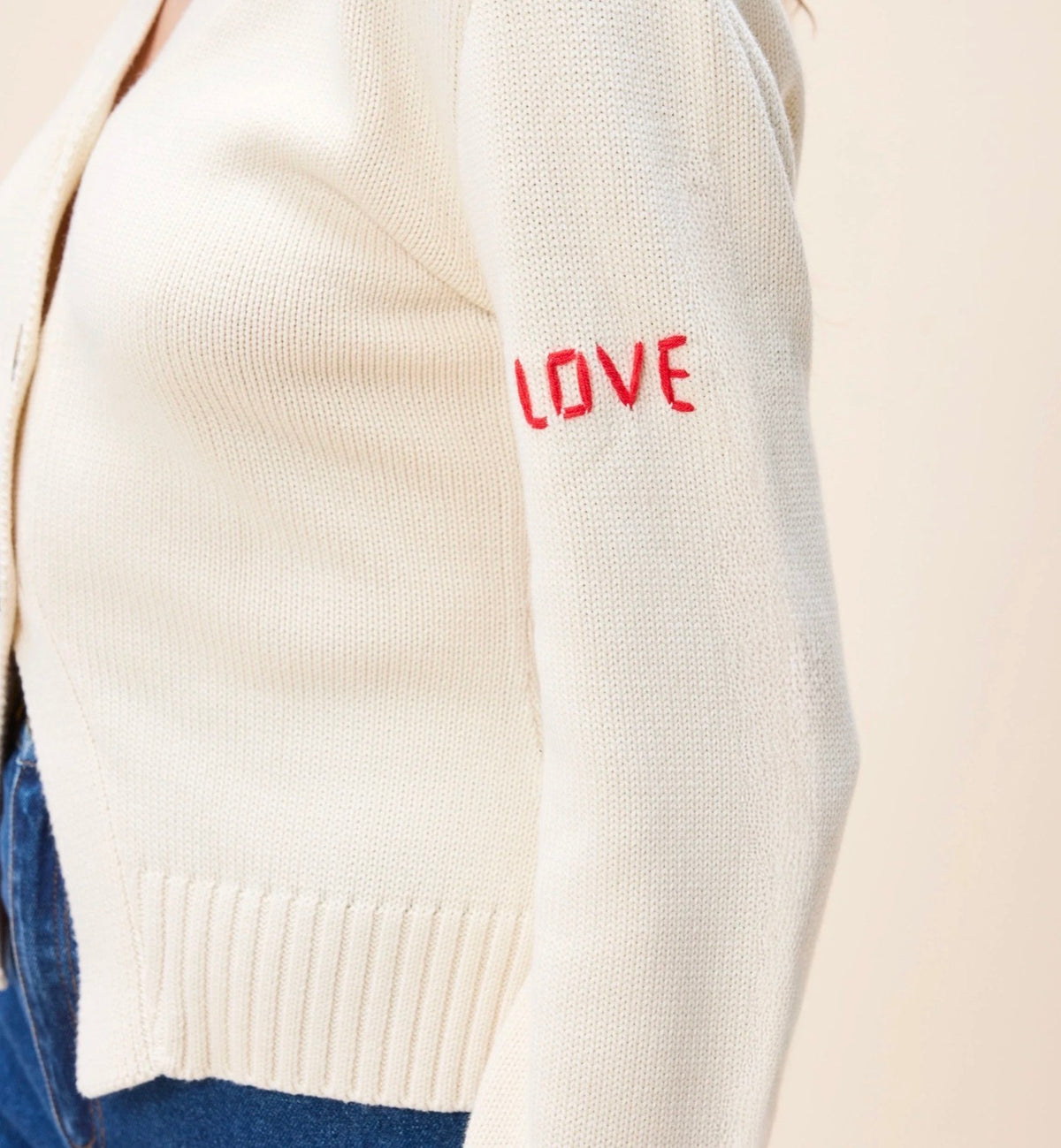 CLEOBELLA Tamsin Sweater in cozy knit, featuring a relaxed fit and ribbed cuffs, displayed on a hanger.