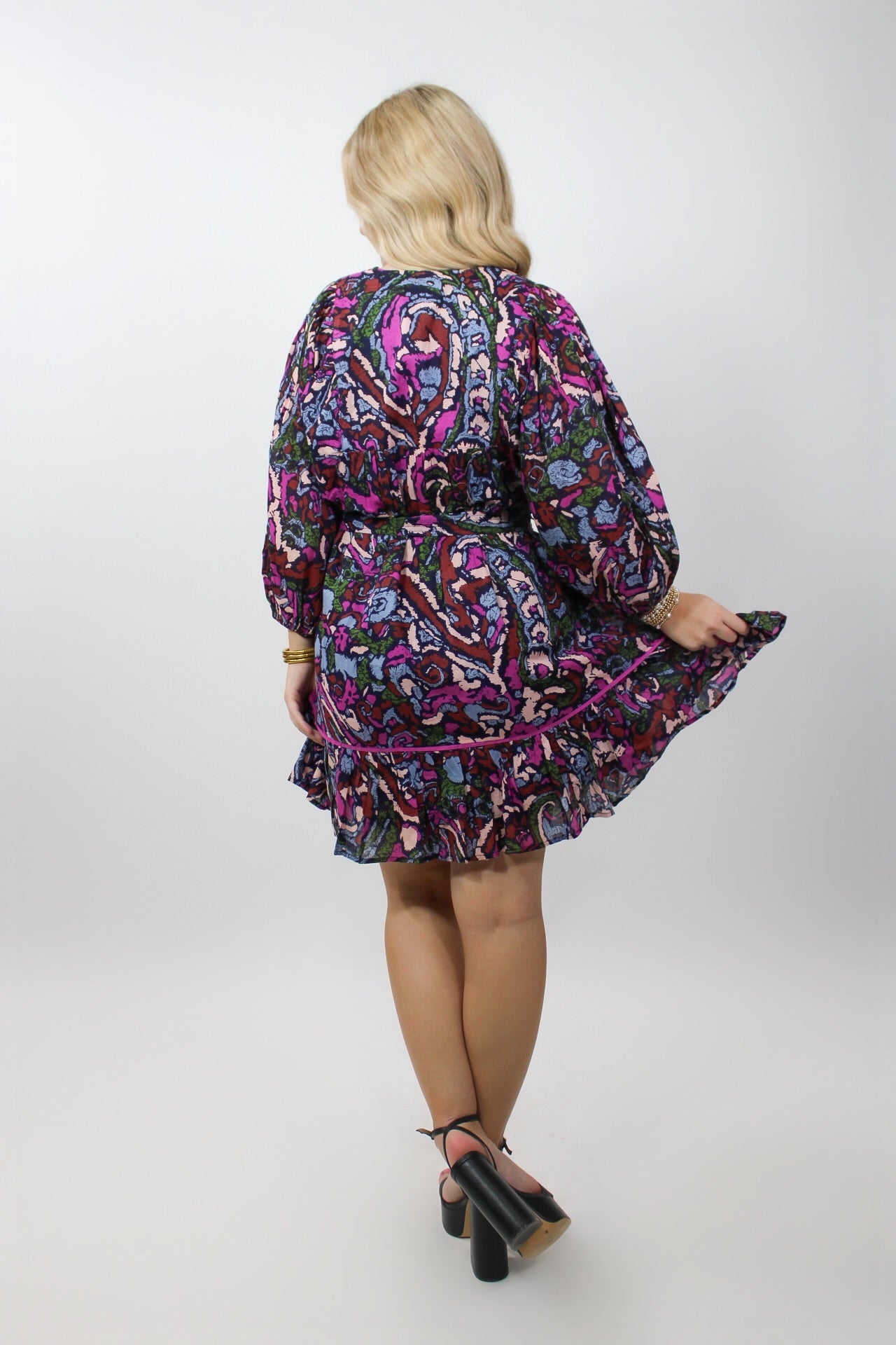 CLEOBELLA Rafaela Mini Dress shown in the image, featuring a stylish, fitted design with a vibrant pattern and elegant neckline.