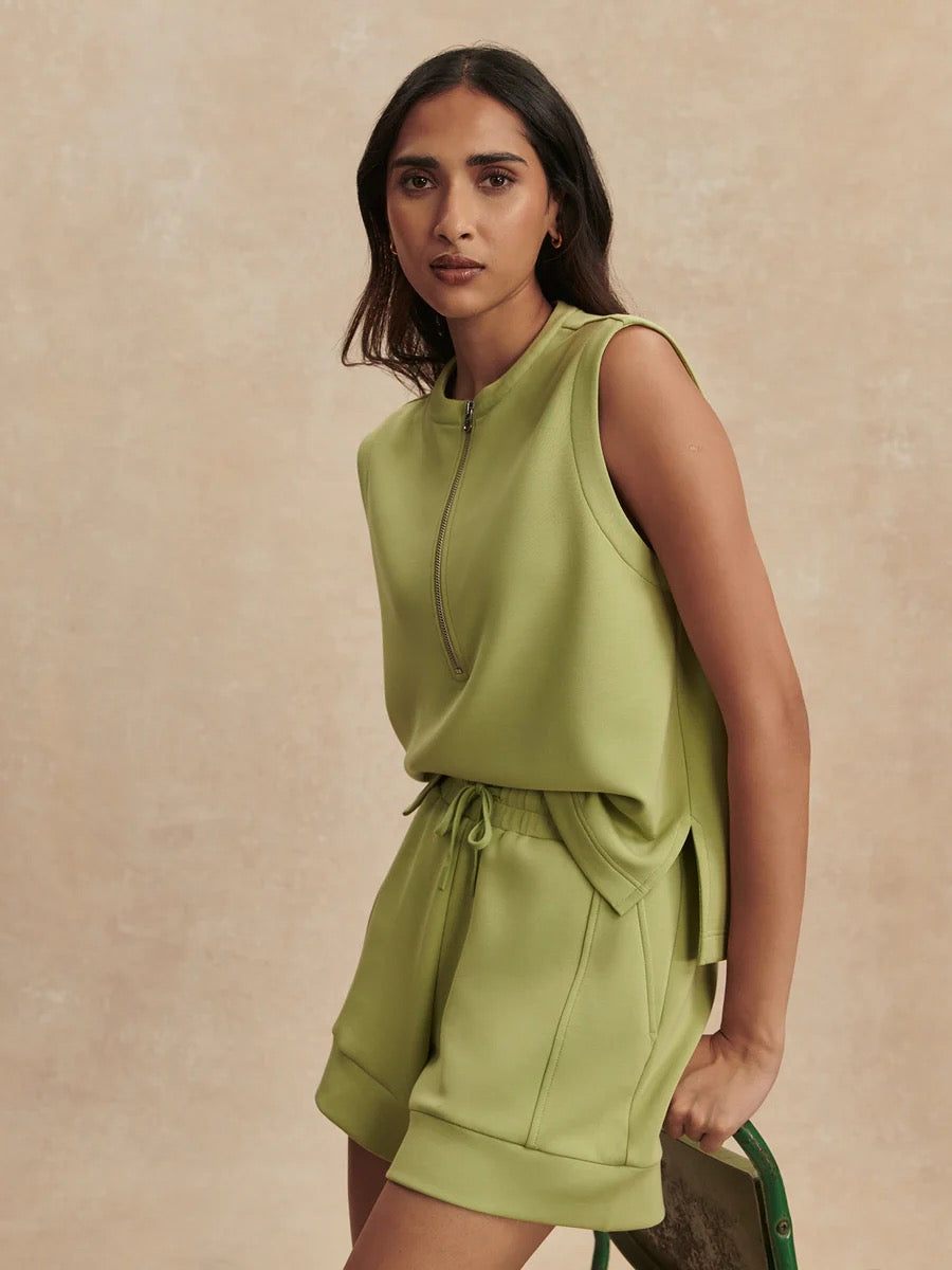 Varley Atrium High Rise Short 4.5 in Fern, lightweight athletic shorts with high-rise fit and breathable fabric, shown on a model.