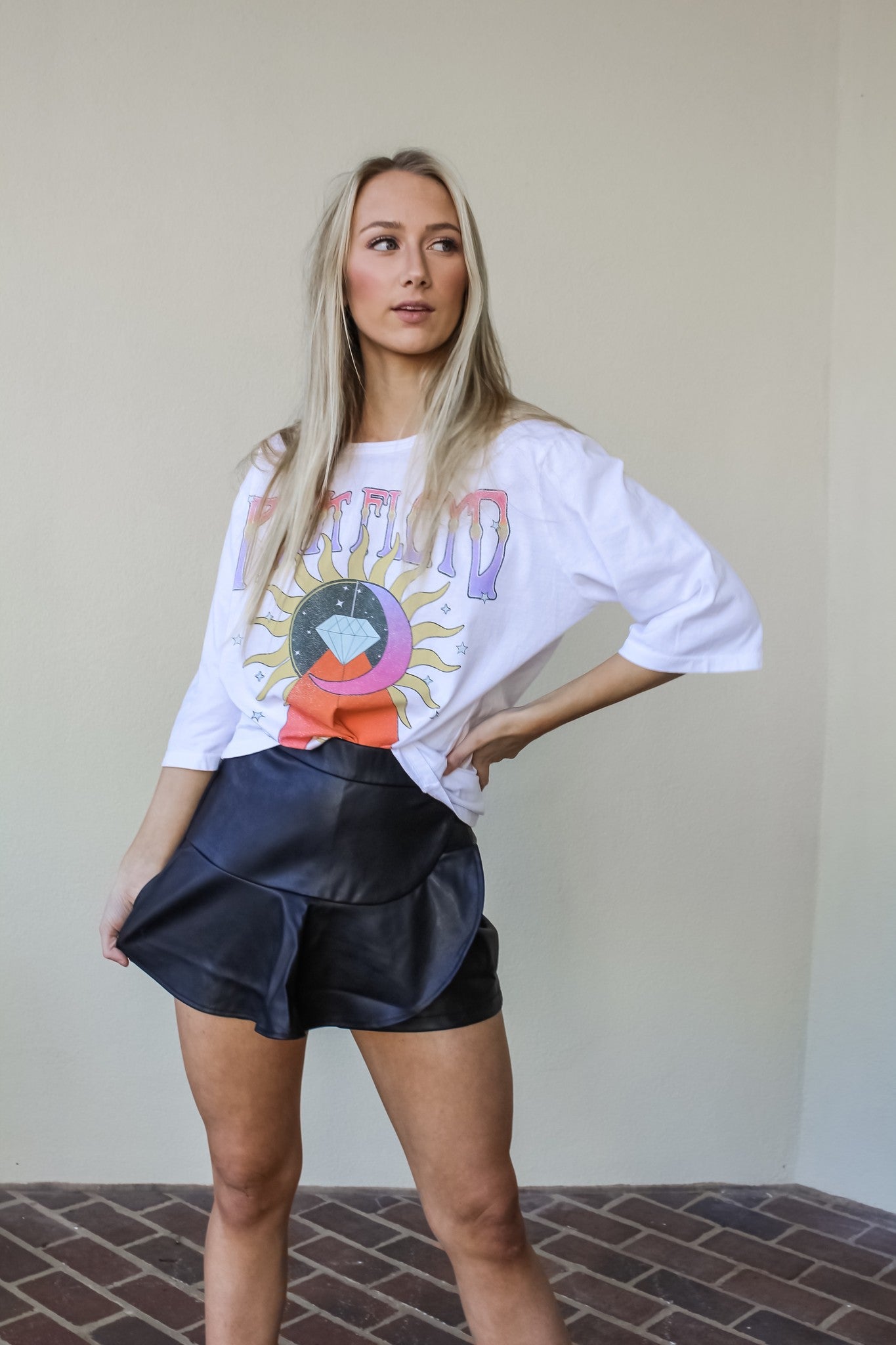Recycled Karma I'm With The Band graphic tee featuring band logo and casual fit, shown on a hanger against a plain background.
