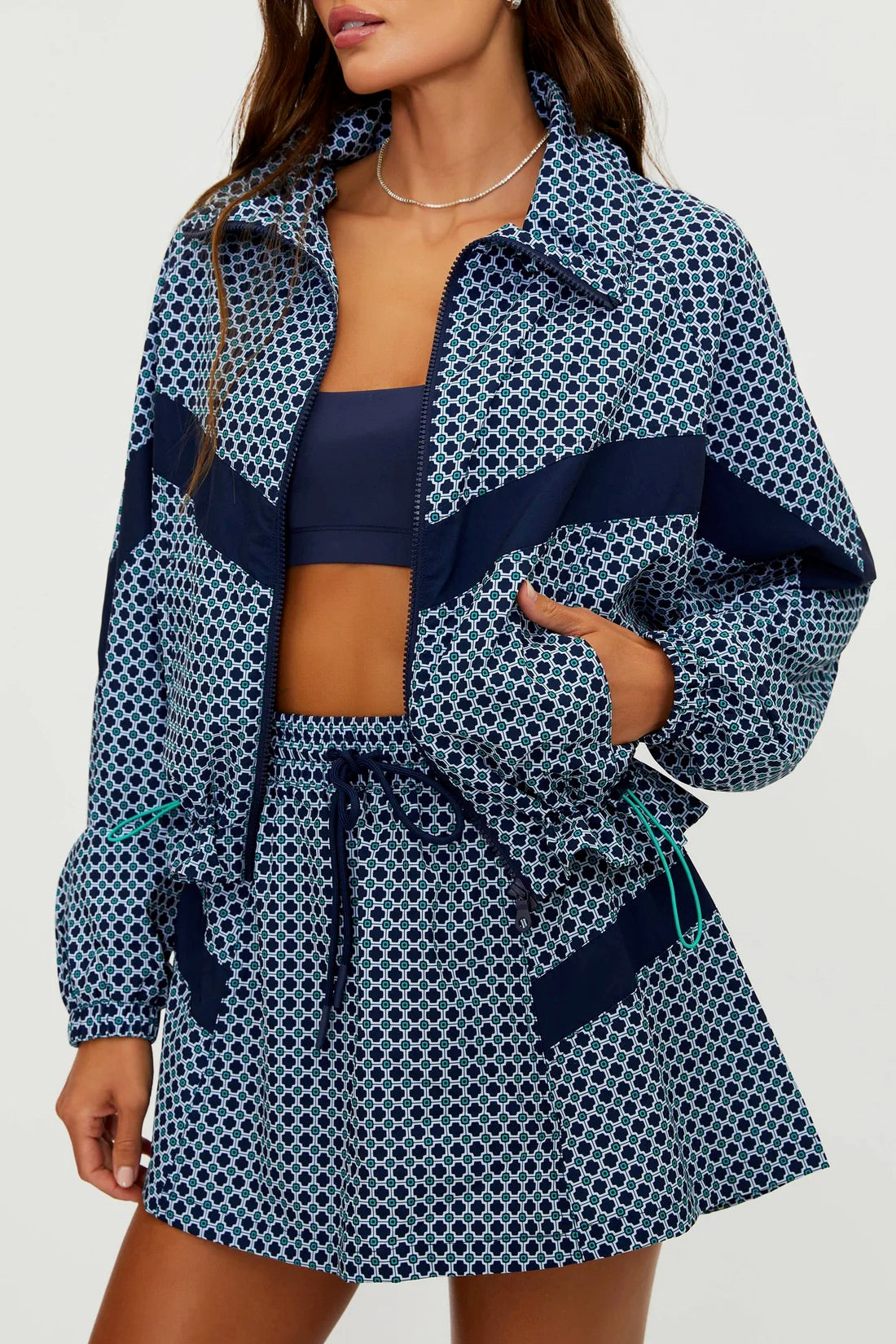 BEACHRIOT Casen Jacket Twilight Tides Geo with vibrant blue and teal geometric pattern, front view on a plain background.