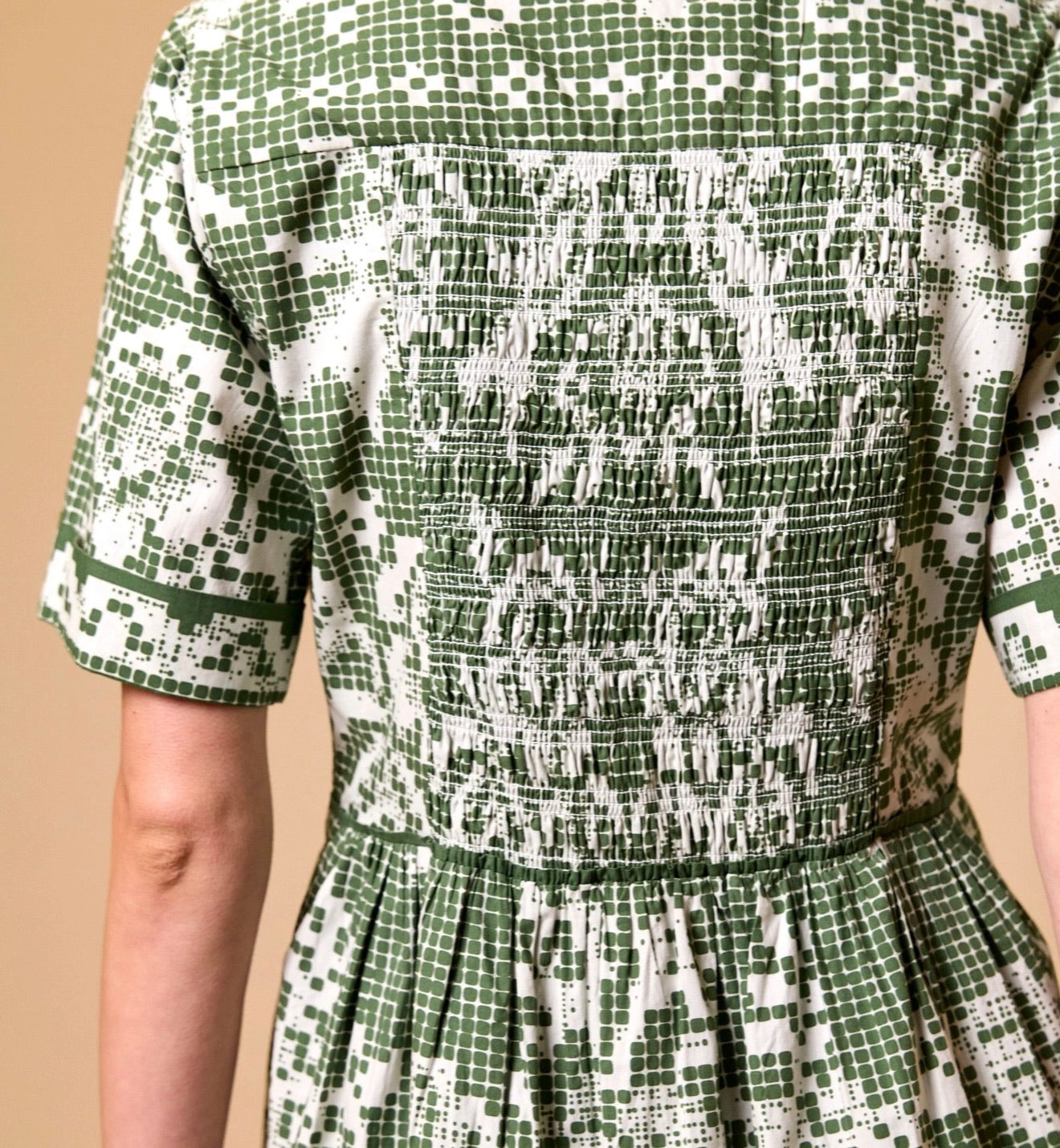 CLEOBELLA Starling Mini Dress in Verdant Flight featuring a flowy silhouette and vibrant green fabric.