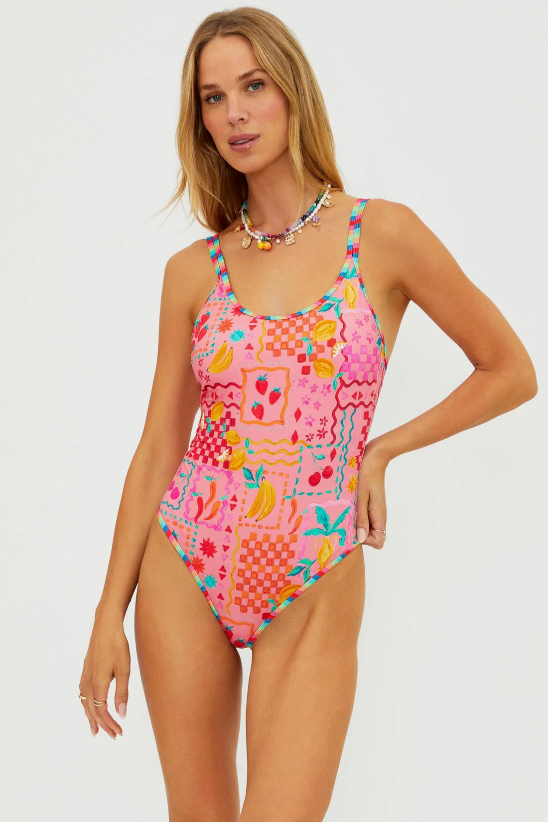 BeachRiot Naomi One Piece swimsuit in Passion Fruit print, featuring vibrant colors and a flattering fit on a model.