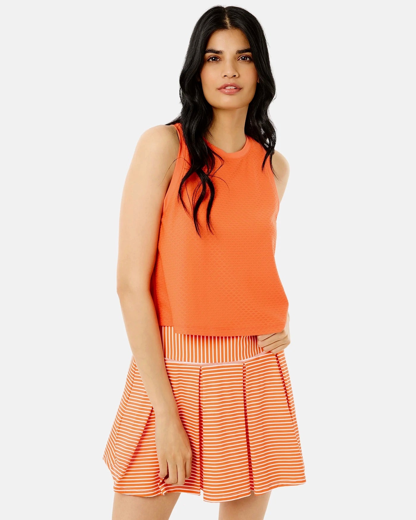 Addison Bay Everyother Day Tank in papaya color, featuring a sleeveless design with a relaxed fit and scoop neckline.