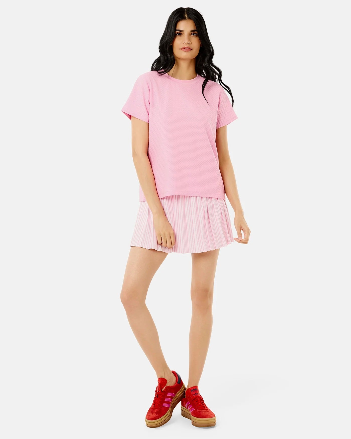 Addison Bay Walnut Short Sleeve top in bubblegum pink, featuring a relaxed fit and soft fabric, displayed on a hanger.