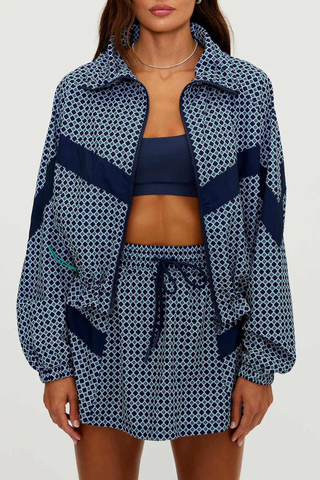 BeachRiot Clyde Skirt in Twilight Tides Geo with flowing fabric and vibrant blue and white abstract pattern.