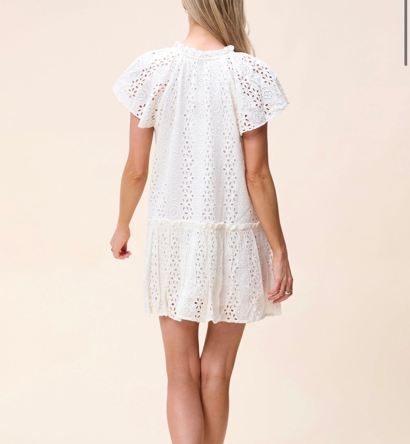 CLEOBELLA Lydia Mini Dress in ivory, featuring a stylish, fitted silhouette with delicate fabric details and a flattering neckline.
