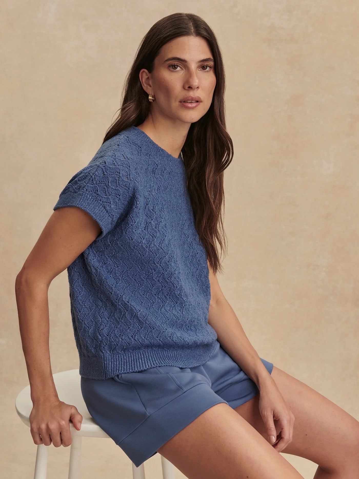 Varley Manae Pointelle Knit Top in Bijou Blue showing a close-up of the lightweight, textured knit fabric and delicate pointelle pattern.