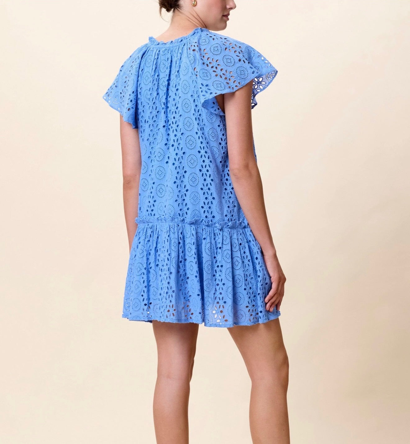 CLEOBELLA Lydia Mini Dress in Blue Bonnet with floral pattern, sleeveless design and lightweight fabric, displayed on a hanger.
