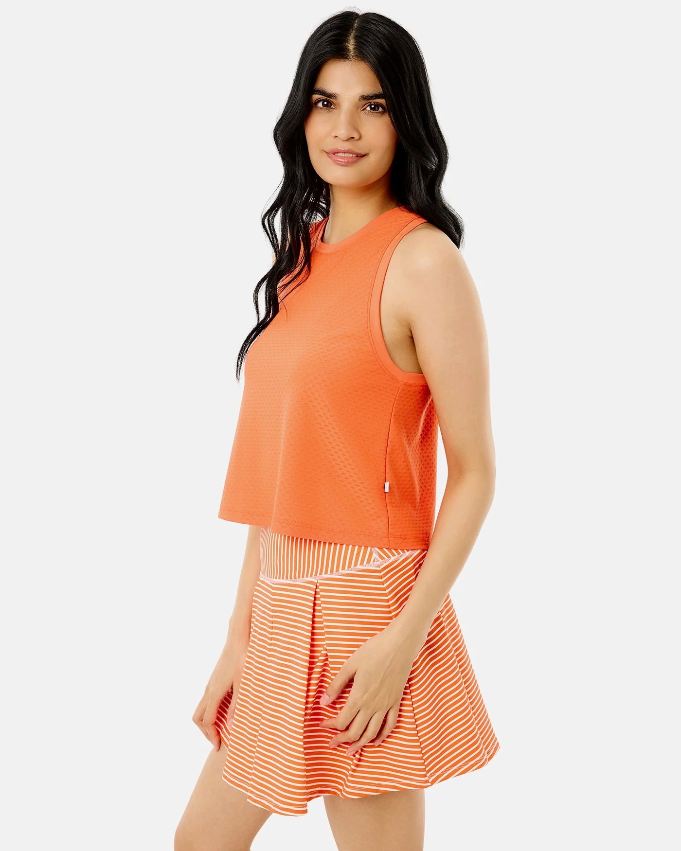 Addison Bay Everyother Day Tank in papaya color, showcasing a lightweight, sleeveless women's tank top with a relaxed fit.