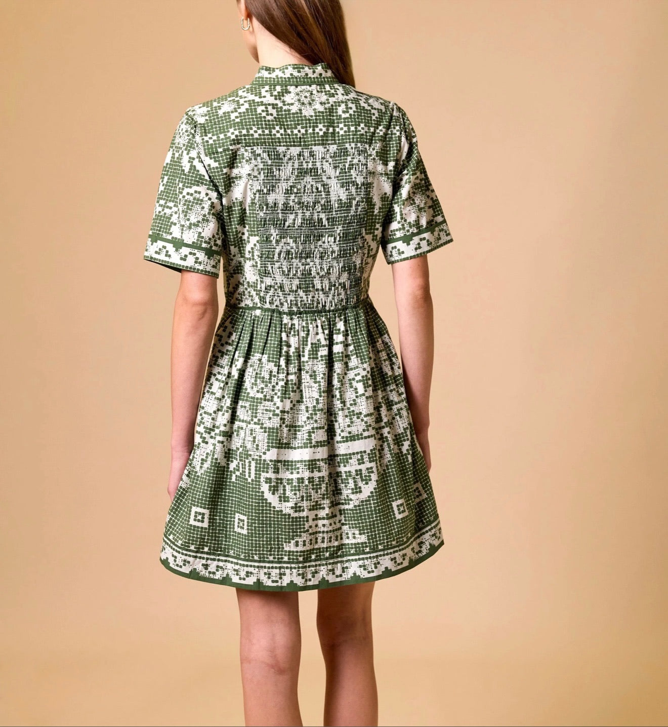 CLEOBELLA Starling Mini Dress in Verdant Flight, green floral print, fitted silhouette with short sleeves and V-neck detail.