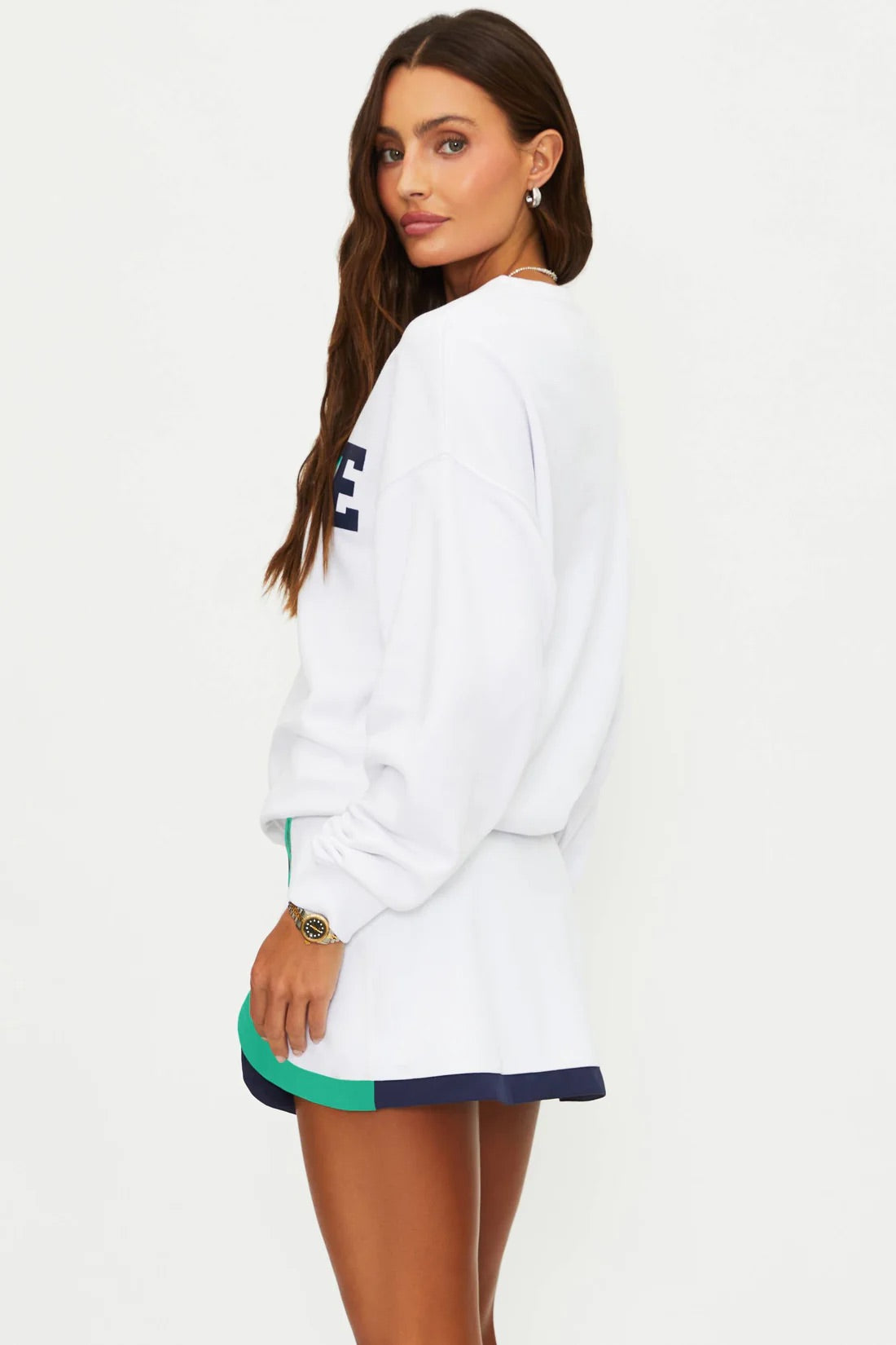 White Devyn oversized sweatshirt by BEACHRIOT, featuring a relaxed fit and soft fabric, displayed on a hanger.