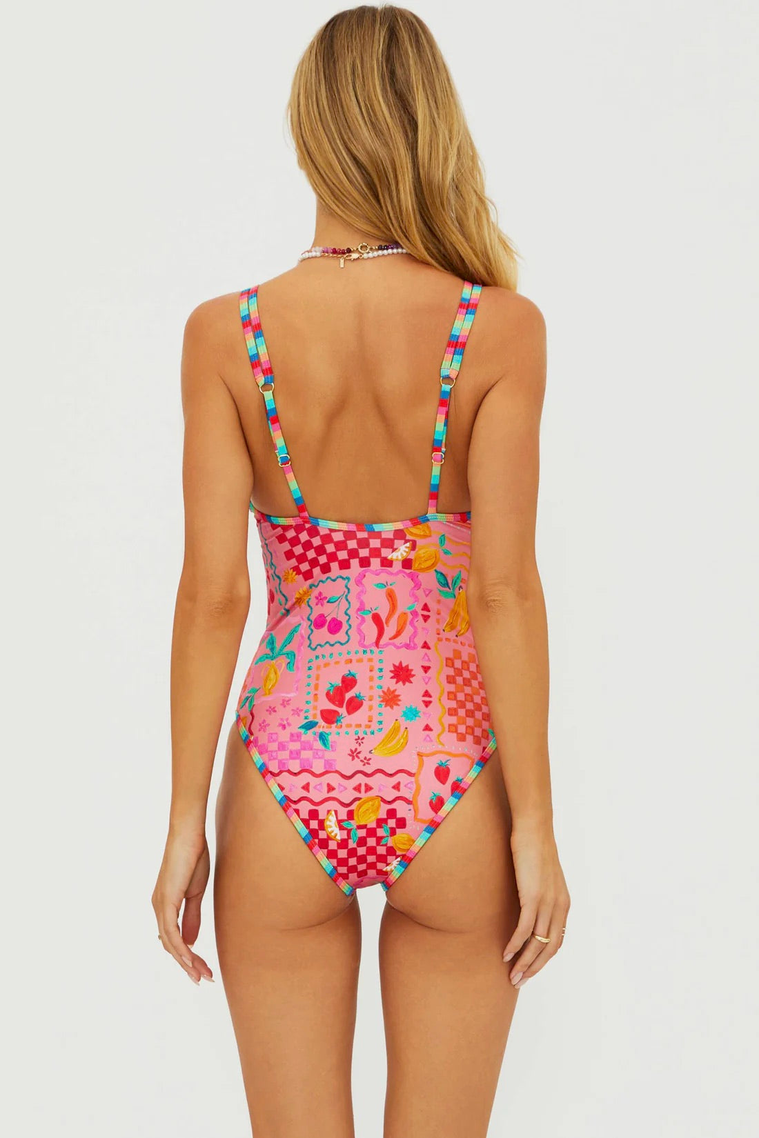 BeachRiot Naomi One Piece swimsuit in Passion Fruit color, featuring a stylish cut and vibrant tropical print.
