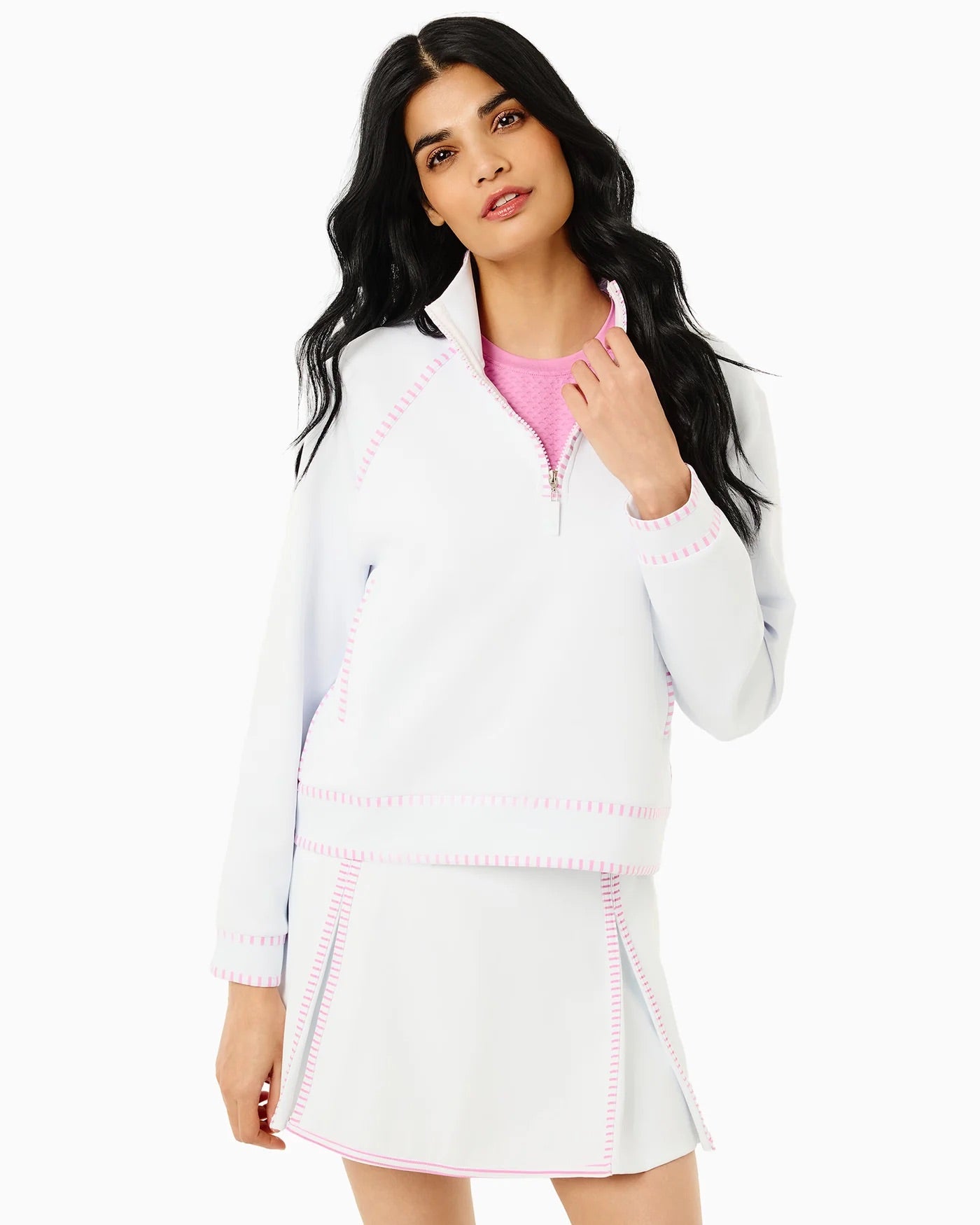 Addison Bay Bainbridge quarter zip in super white and orchid, featuring a close-up of the stylish white and purple color-block design.
