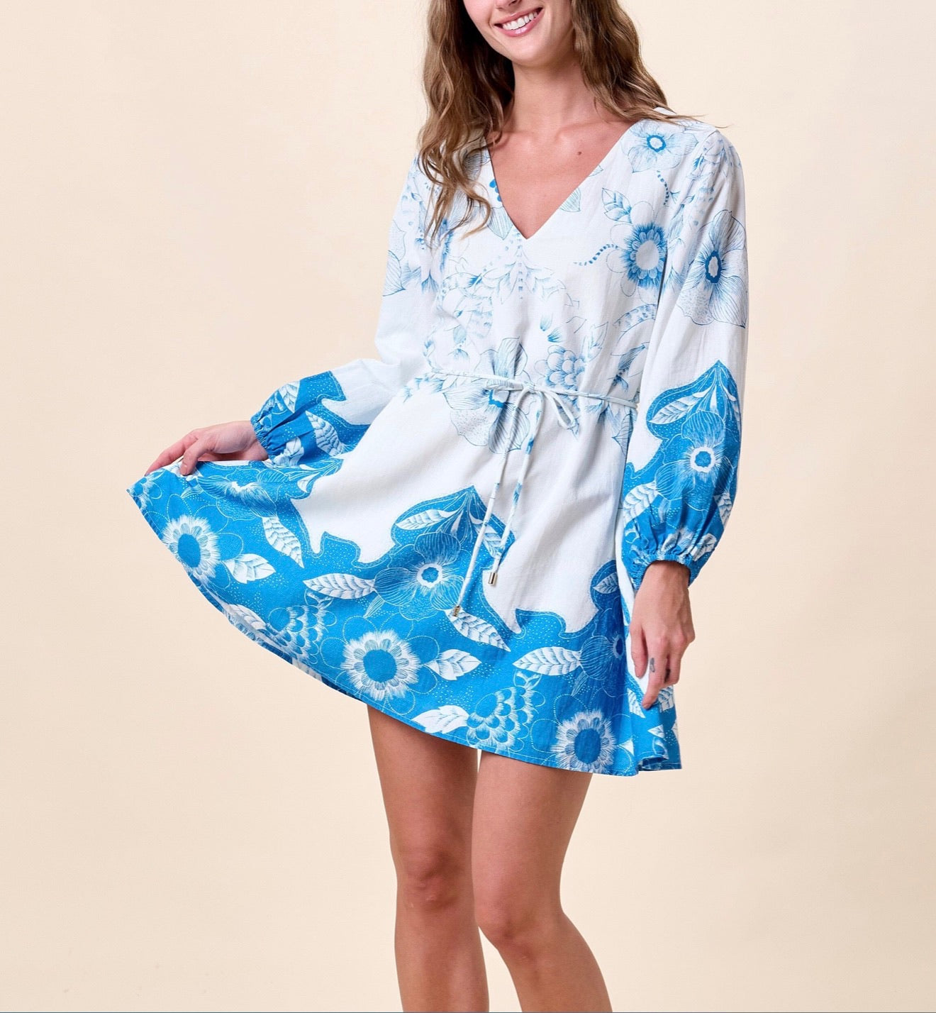 Noemie Mini Dress by CLEOBELLA in Celestia fabric, featuring a stylish, fitted silhouette with delicate details and vibrant color.