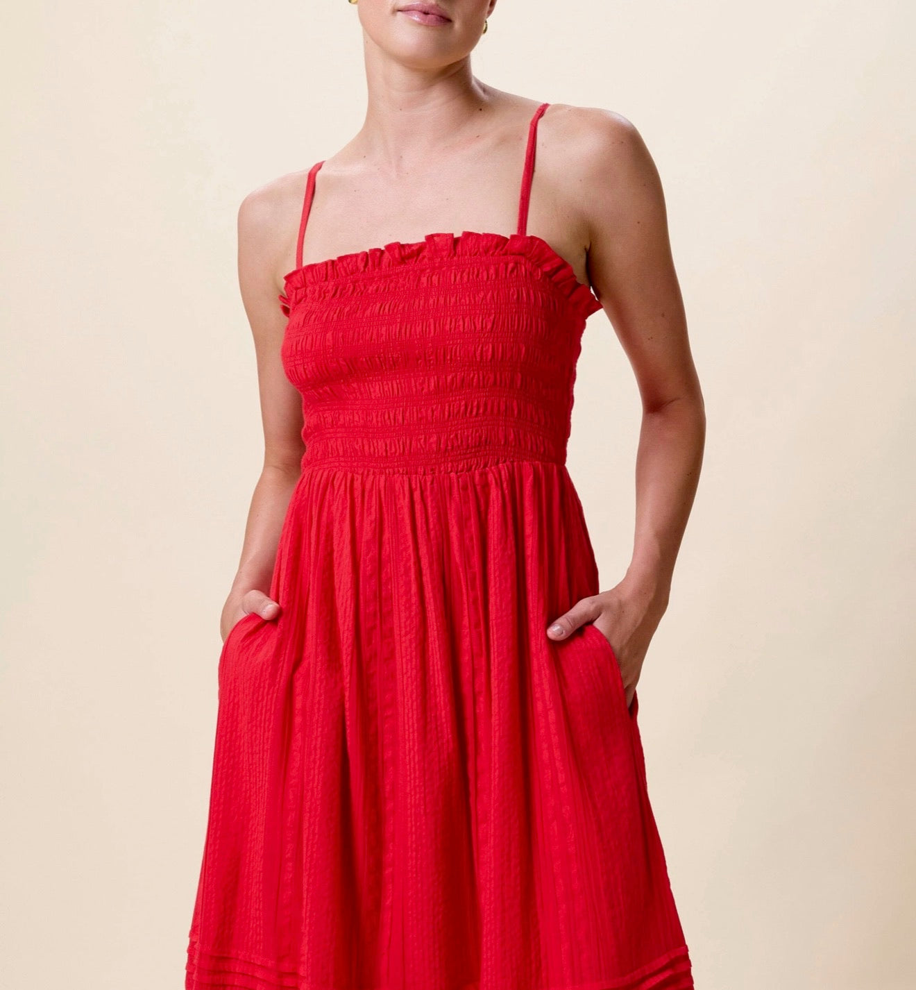 Magnolia Ankle Dress by CLEOBELLA in Goji Berry color, featuring a flowy silhouette and floral pattern, displayed on a hanger.