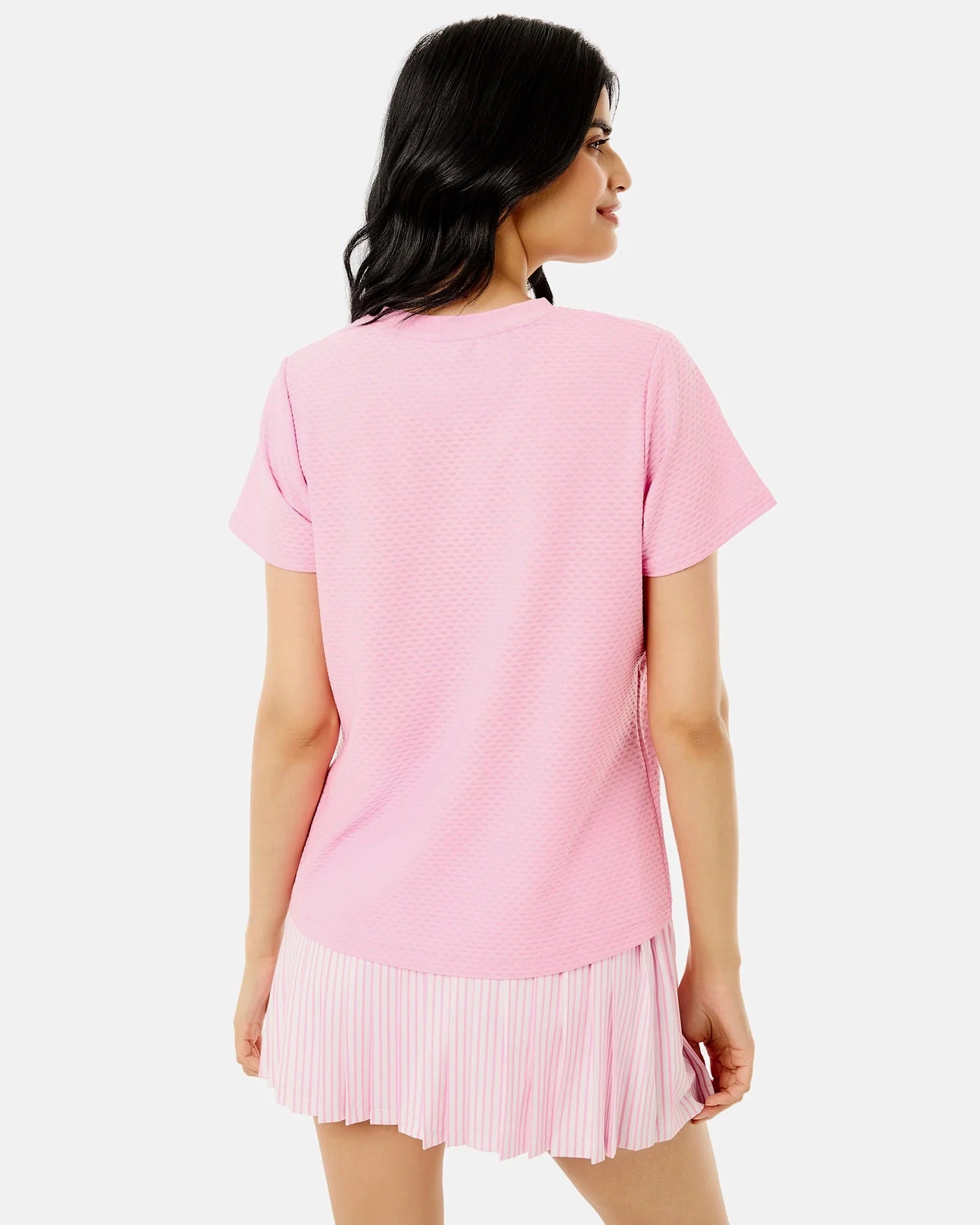 Addison Bay Walnut Short Sleeve top in bubblegum pink, featuring a relaxed fit and soft fabric, displayed on a hanger.
