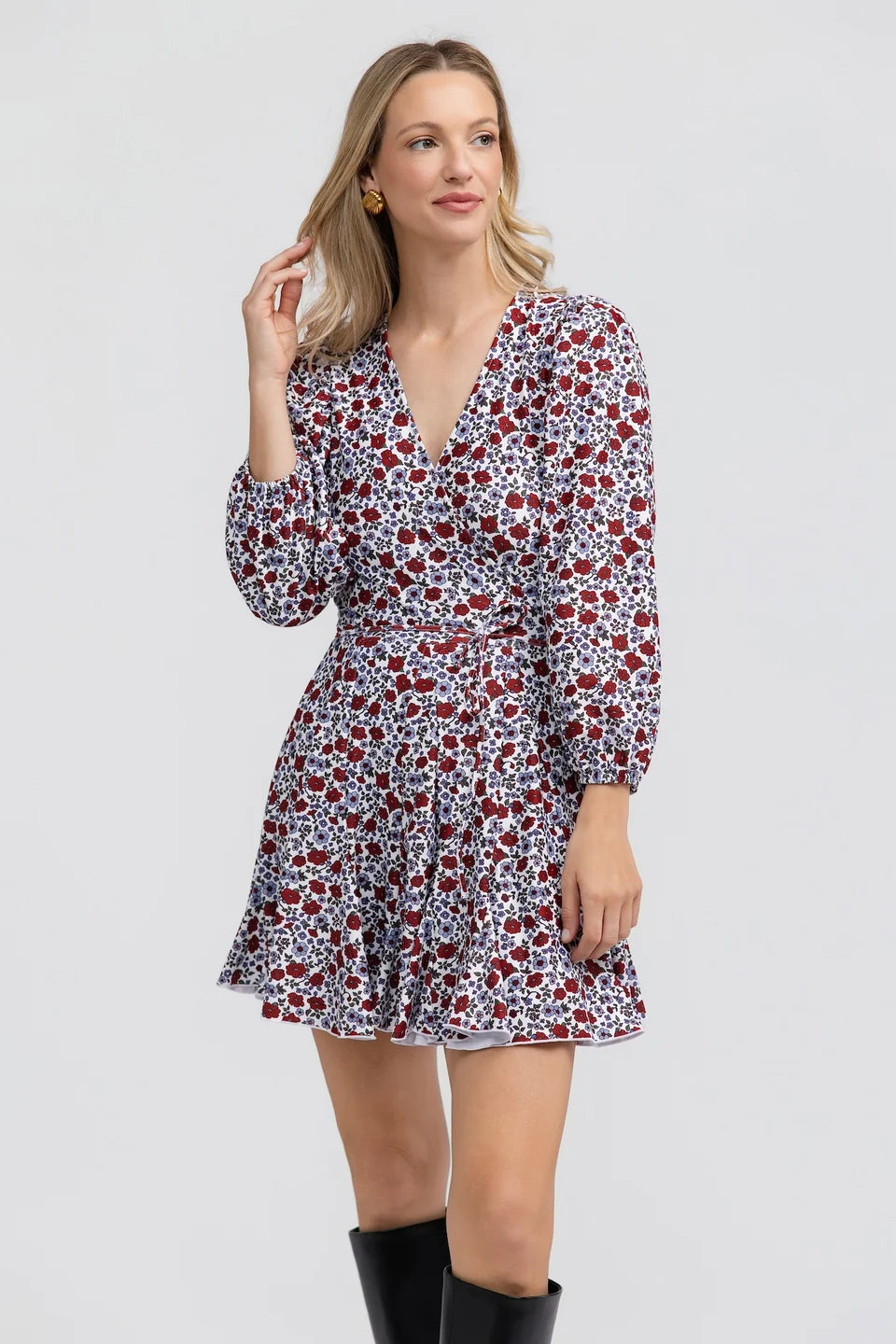 Smith & Quinn Sterling Dress in Bittersweet Bloom with floral pattern and flowing fabric, displayed on a hanger.