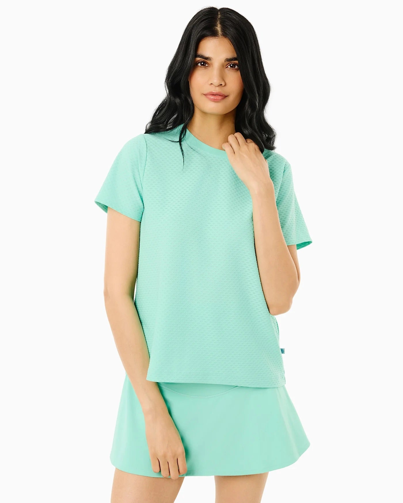 Walnut short sleeve top by Addison Bay featuring jelly mint color, displayed on a hanger against a neutral background.
