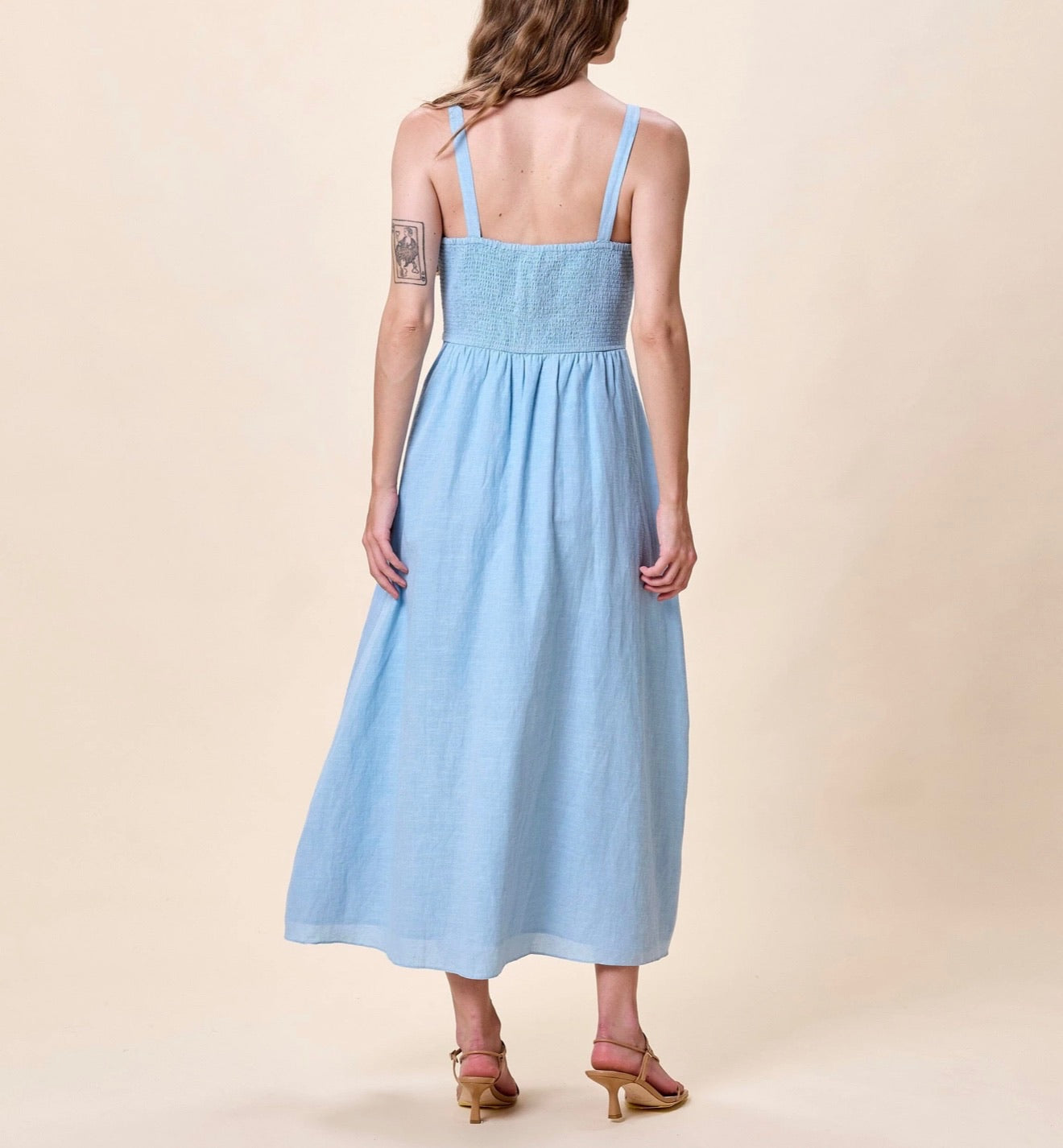 CLEOBELLA Marceline Midi Dress in Glacier Lake with flowing fabric and elegant design, showcased on a model.
