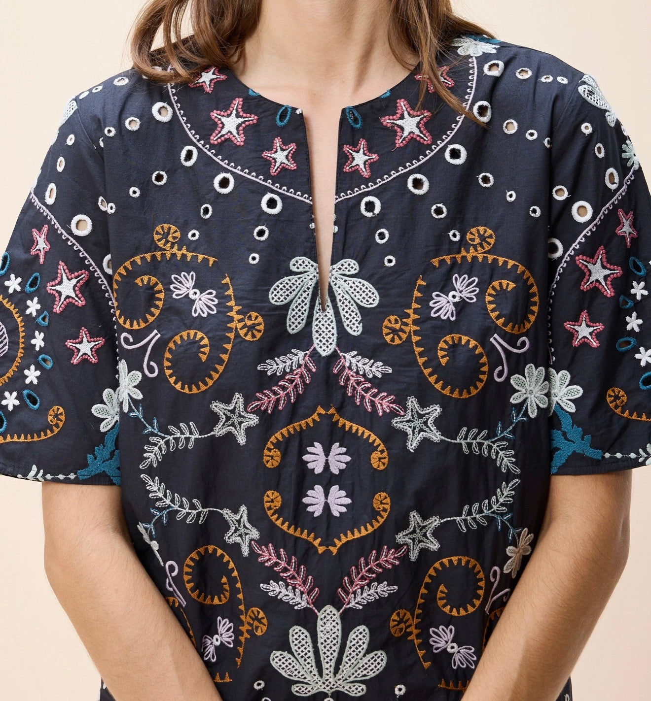 Black Mische Mini Dress by CLEOBELLA displayed on a hanger with detailed fabric texture and stylish design.