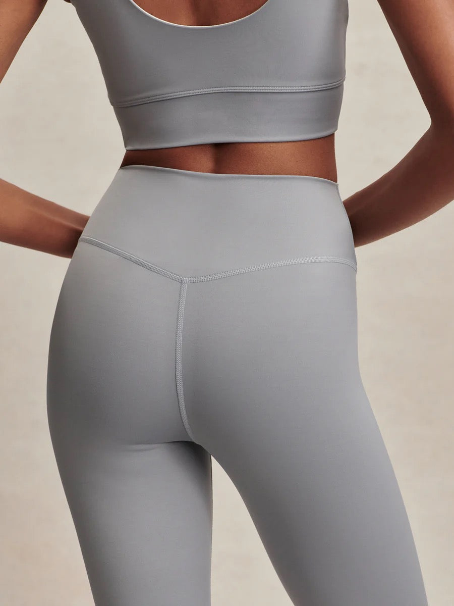 Assure High Rise Legging 25 in Wind Blue by Varley, showing the sleek, high-waisted athletic leggings with a smooth fit and subtle branding.